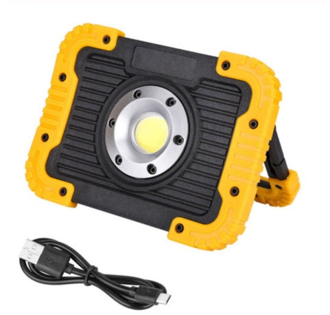 Portable LED area light lighting a room during a power cut